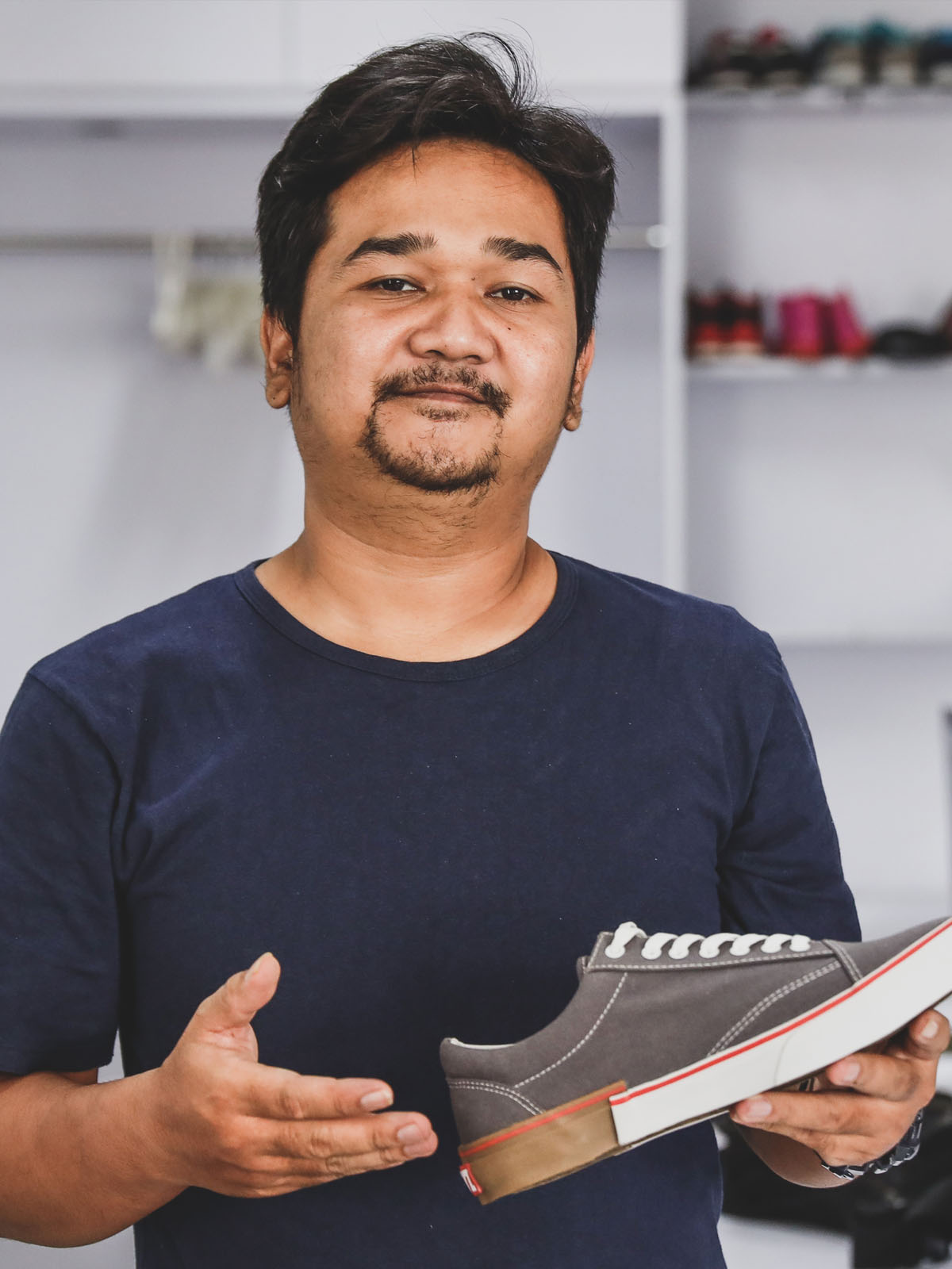 Man holding shoe representing email marketing reach